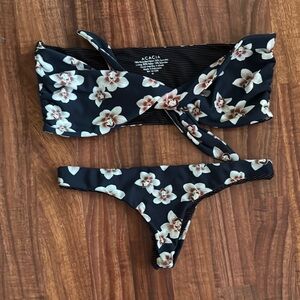 Acacia Swimwear Navy background with Orchids